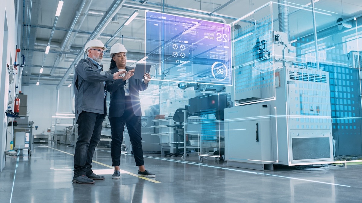 colleagues discussing the digital supply chain while on the manufacturing floor 