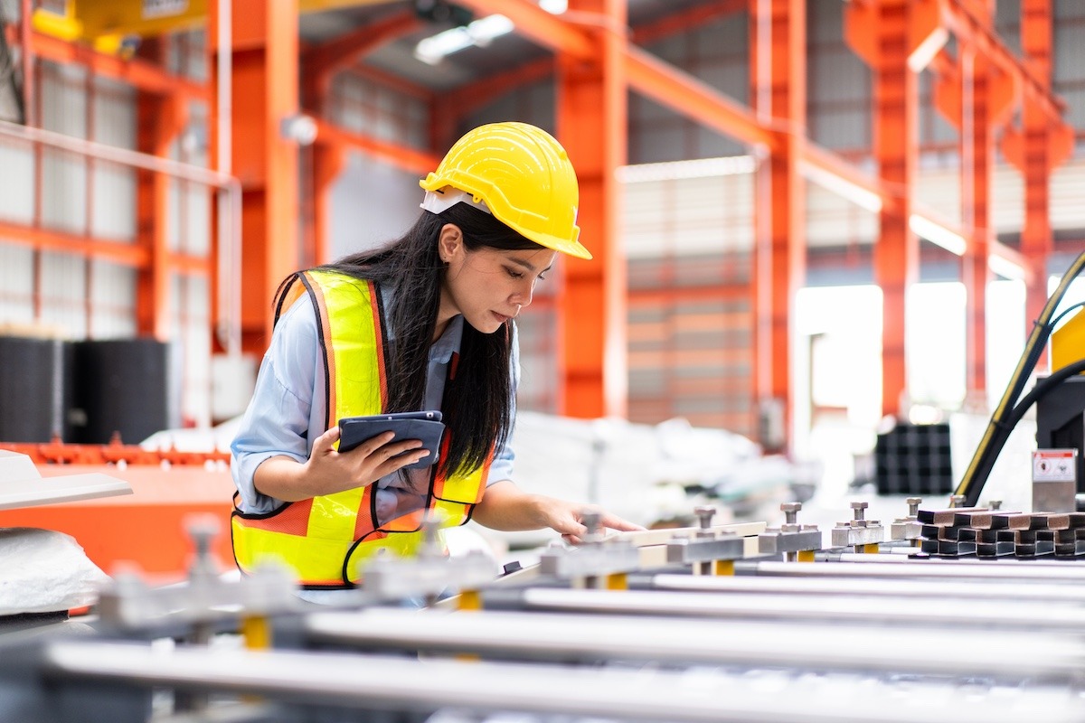 an engineer reviewing electronic work instructions on a tablet